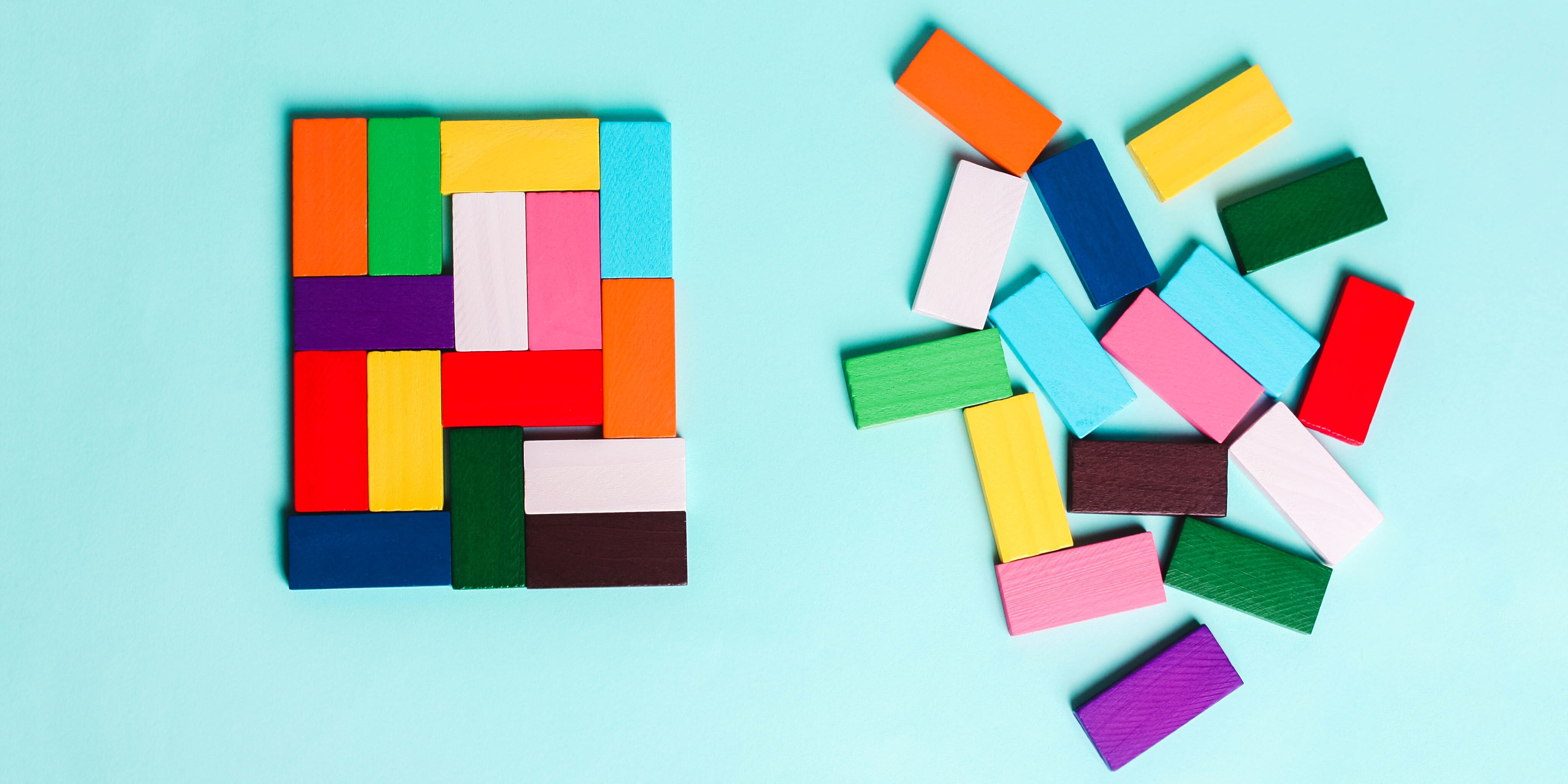 Disorganized group of colored wooden block vs. blocks organized into a square