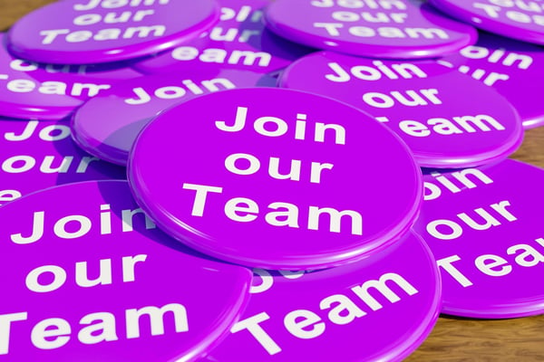 Purple campaign buttons with white lettering that says Join our Team