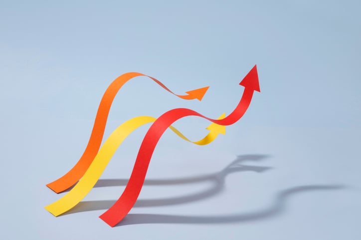 Three upward-curving arrows representing increasing rebate capture rates and long-term revenue growth