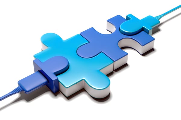 Interlocking blue and turquoise puzzle pieces