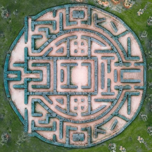 circular maze on green background