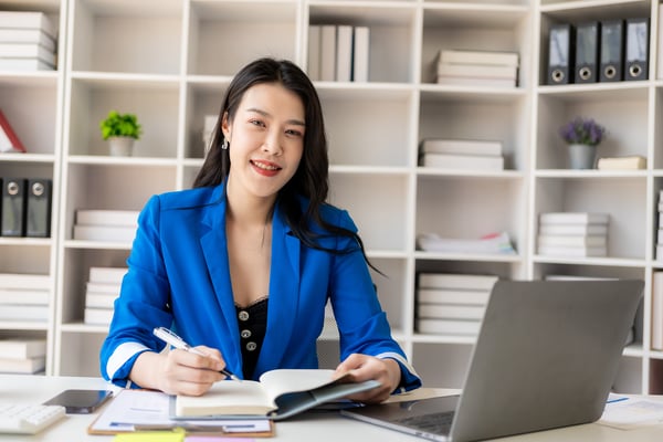 Smiling businesswoman in a blue suit