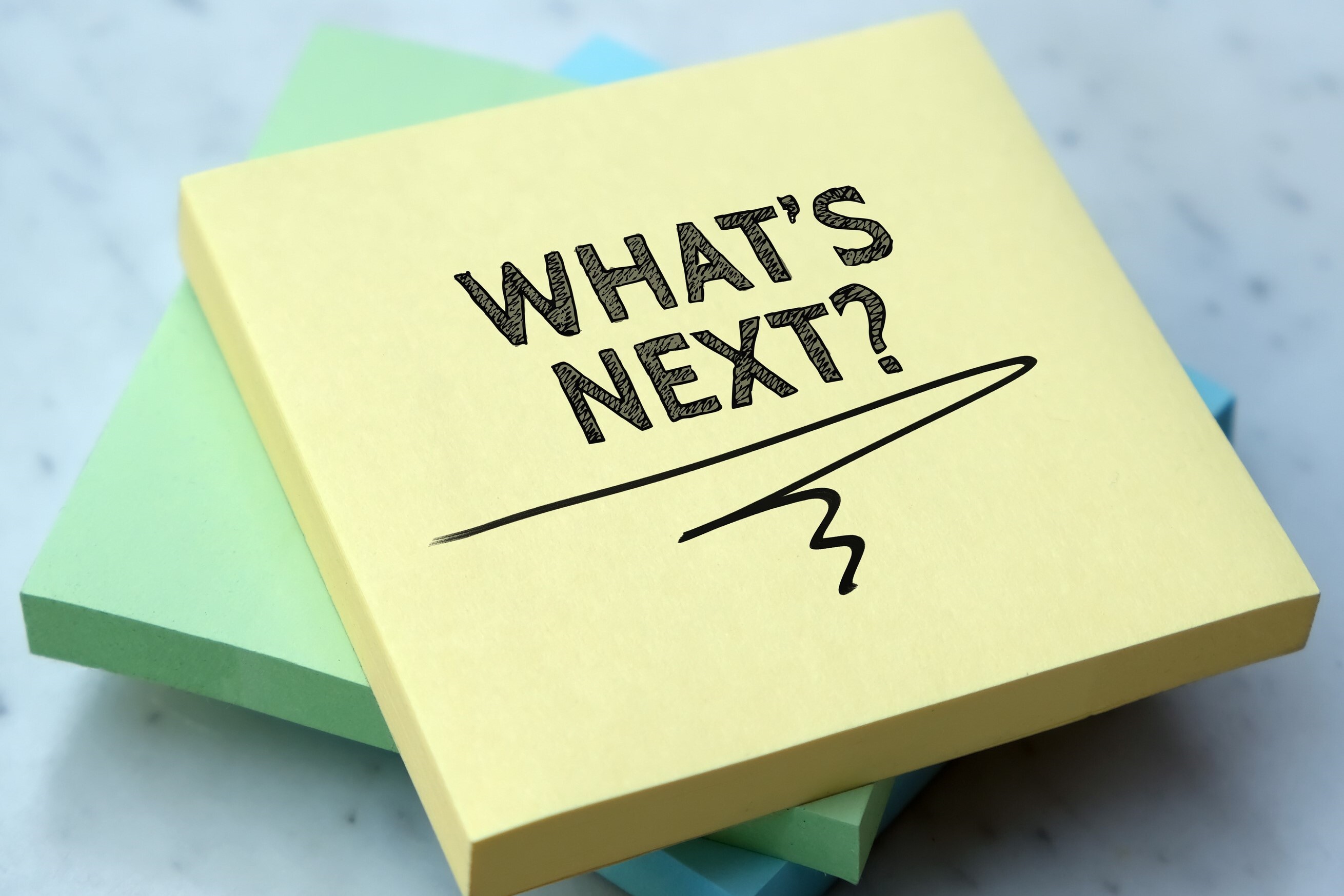 Whats next written on a yellow post-it