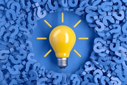 Yellow light bulb on a blue background
