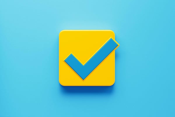 Blue checkmark in yellow box on a lighter blue background