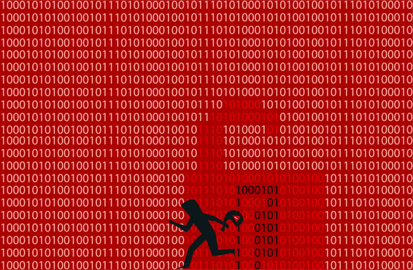 A figure representing a hacker superimposed on a red background and binary software code