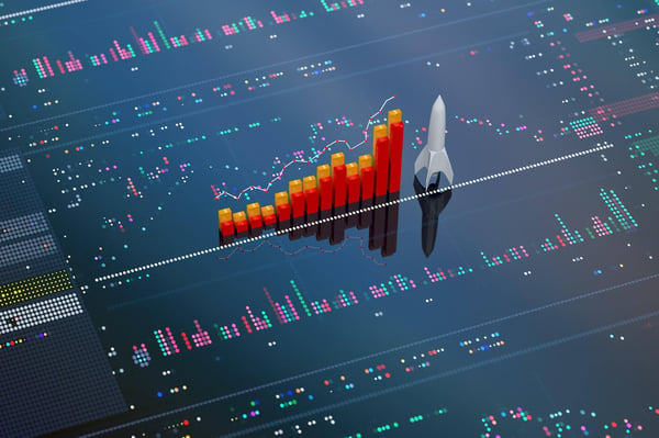 Red and yellow bar chart and a white rocket  shown on a background that represents technology providing analysis