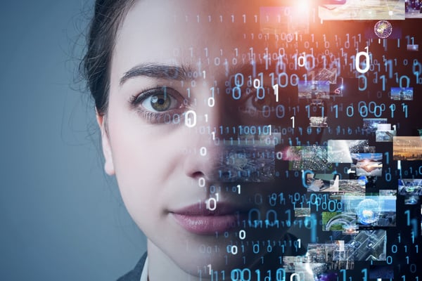 Woman gazing into the distance with computer code covering half of her face