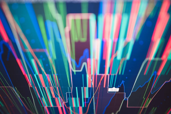 Abstract image of converging multi-colored lines representing high frequency data in cloud computing and adoptive AI systems