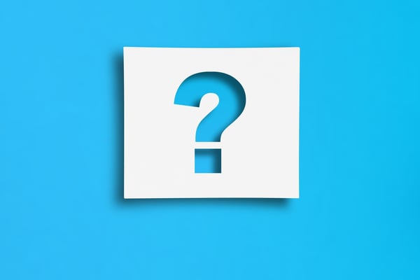 Sky blue question mark on a white card. The white card is overlayed on a sky blue background