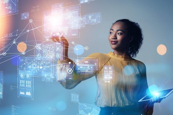 Businesswoman looking at a chart on a transparent wall