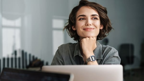 Smiling woman at computer