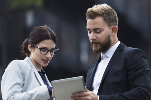 Man and woman and tablet