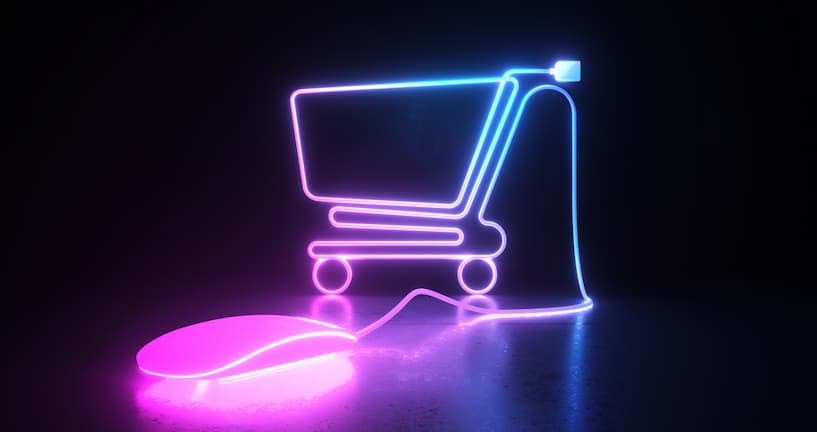 Leuchtendes Einkaufswagensymbol vor schwarzem Hintergrund