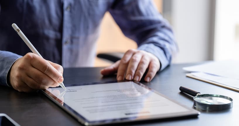 Man signing a digital contract