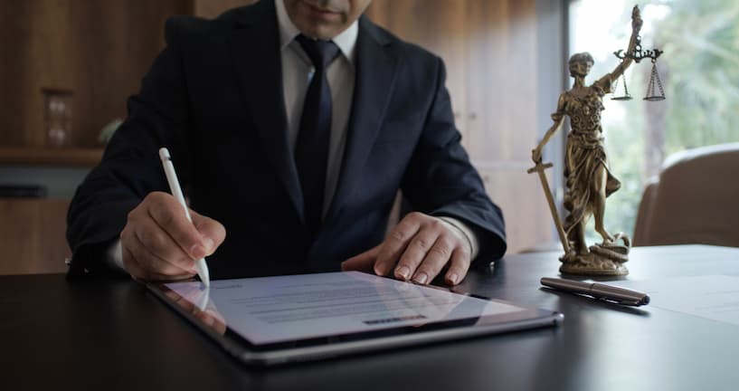 lawyer edits document on a tablet