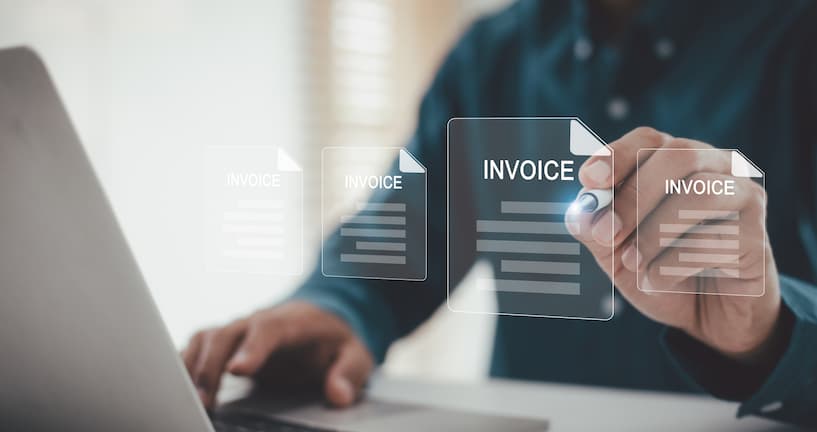 Digital Invoice Management and Optimization: Businessman Working on Laptop with Virtual Invoices and Financial Documents in Modern Office.