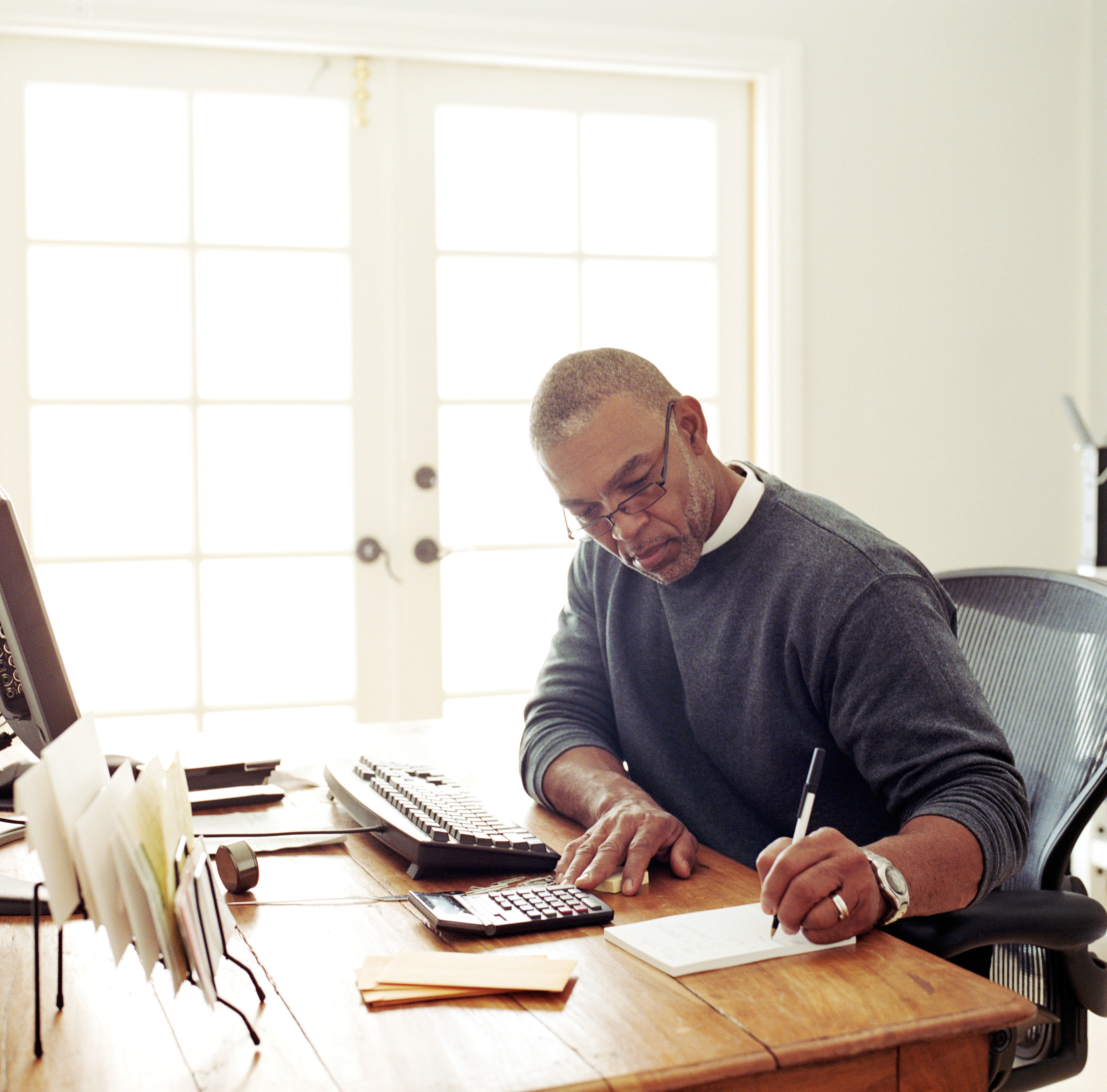 Mature Man Working Remotely at Home