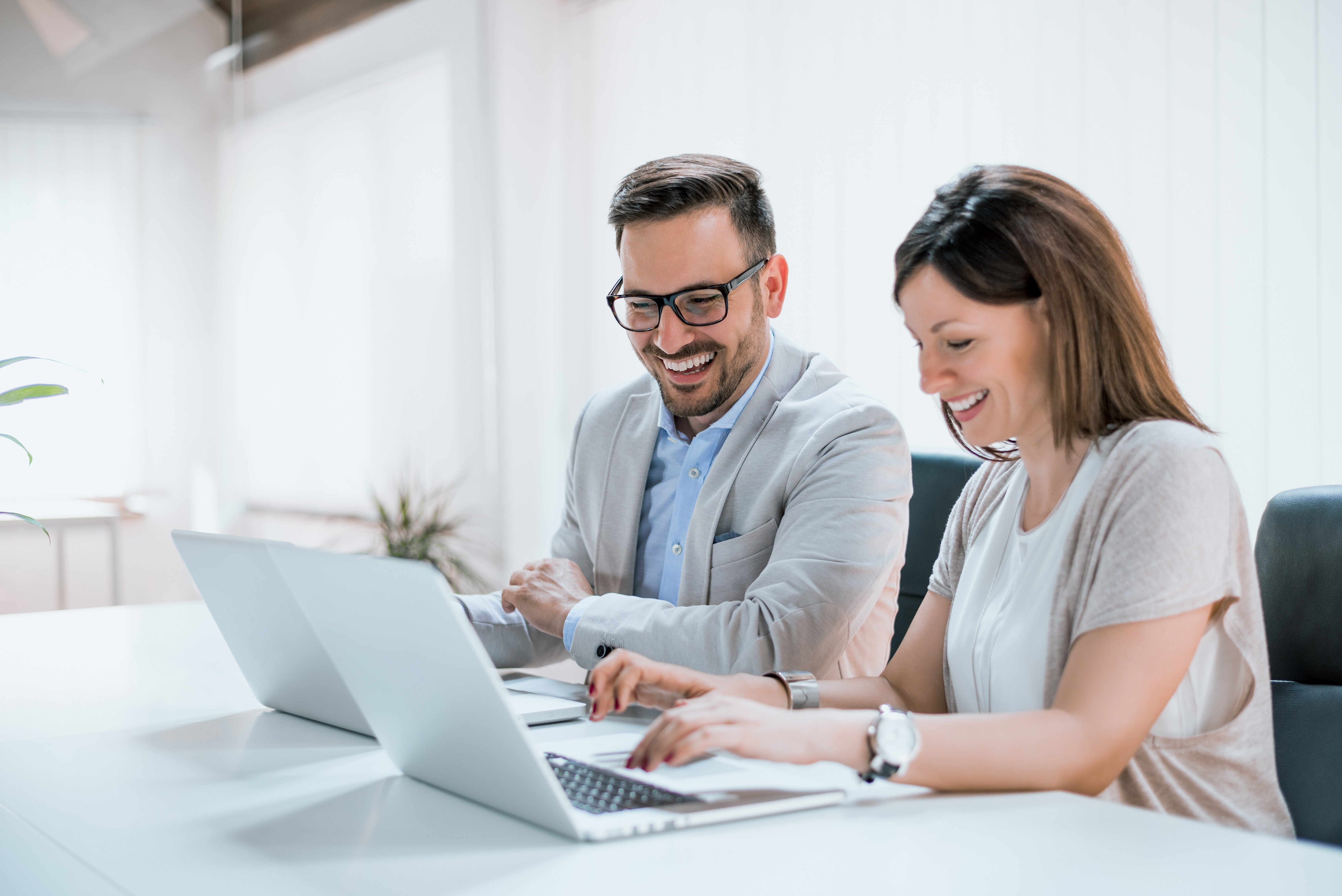 Two customers completing trainings online