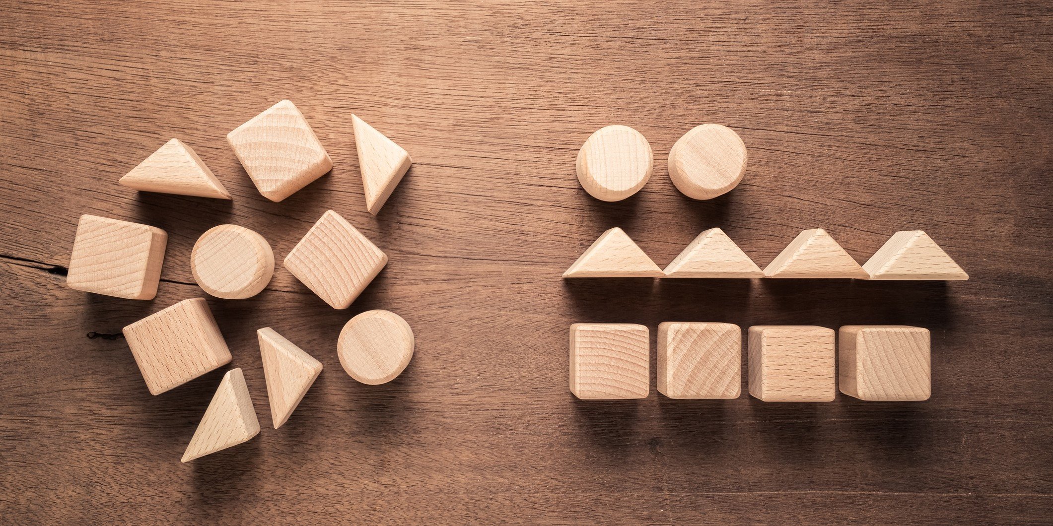 Disorganized geometric shaped wood blocks on left are rearranged in order on the right